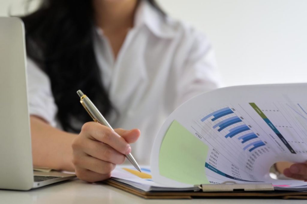 photo of a woman reviewing a business report