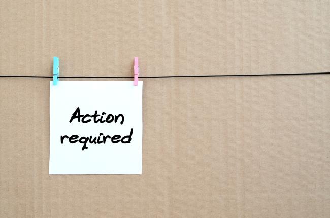 note with the words "action required" clipped to a string.