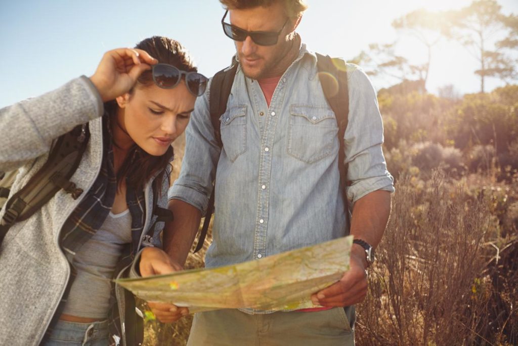 photo of hikers looking at a map.