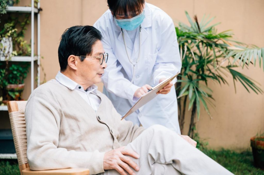Senior man reviewing details with a doctor he trusts
