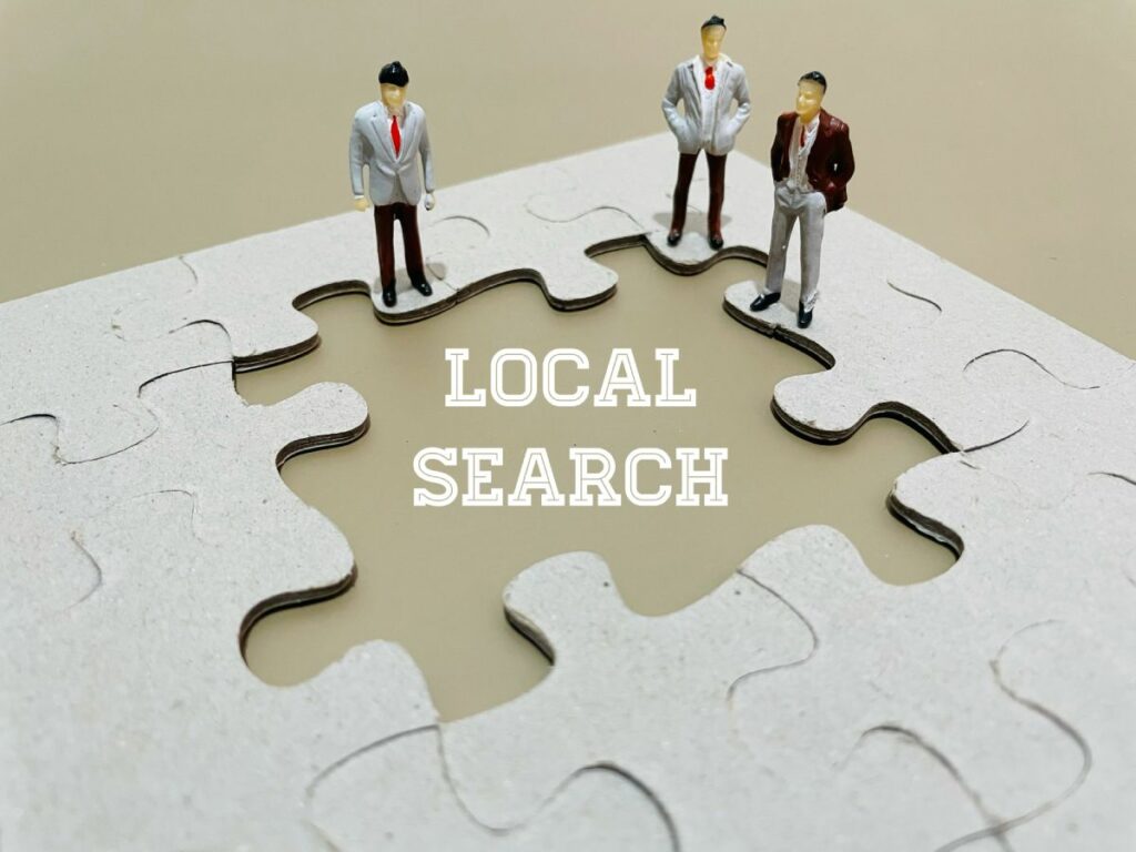 Figurines on a jigsaw that says "local search"